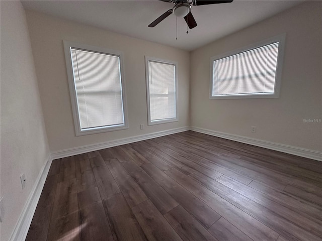 unfurnished room with dark wood-type flooring and ceiling fan