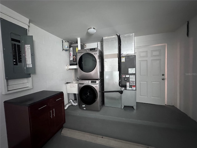 clothes washing area with heating unit, stacked washer and dryer, and electric panel