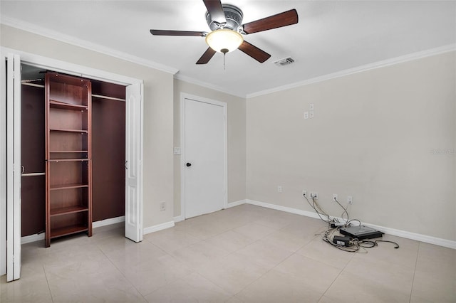 unfurnished bedroom featuring ceiling fan, ornamental molding, and a closet