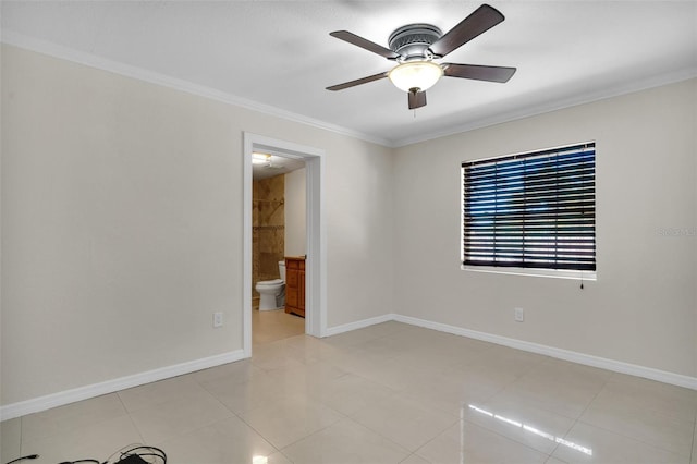 spare room featuring light tile patterned flooring, ceiling fan, and ornamental molding