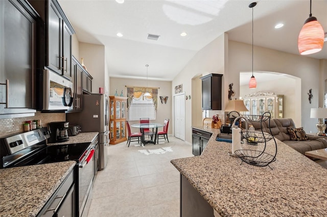 kitchen with sink, hanging light fixtures, and stainless steel appliances