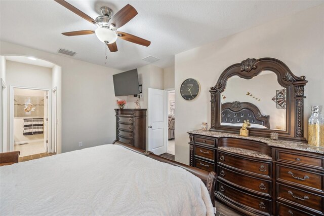 bedroom with ceiling fan and ensuite bathroom