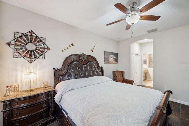 bedroom with ceiling fan and ensuite bathroom