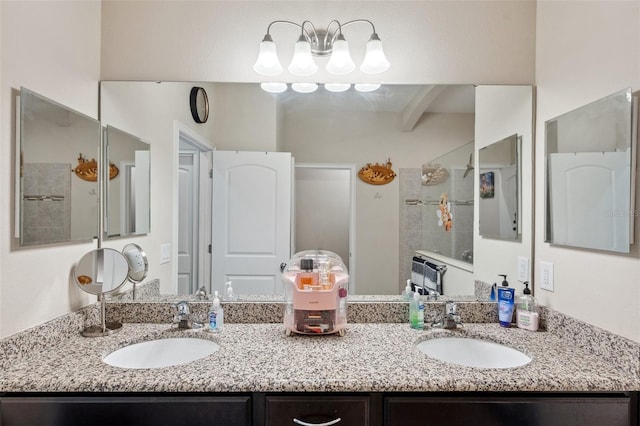 bathroom featuring beam ceiling, walk in shower, and vanity