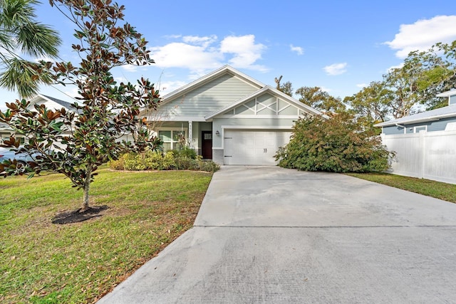 view of front of home with a garage and a front yard