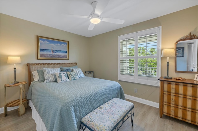 bedroom with ceiling fan and light hardwood / wood-style floors