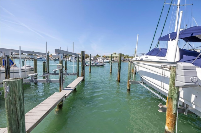 340 Pinellas Bayway S Unit 306, Tierra Verde, FL 33715 - dock with boat lift and a water view
