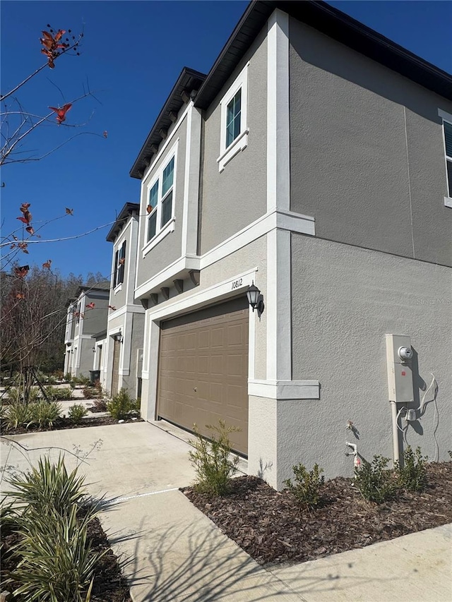 view of property exterior with a garage