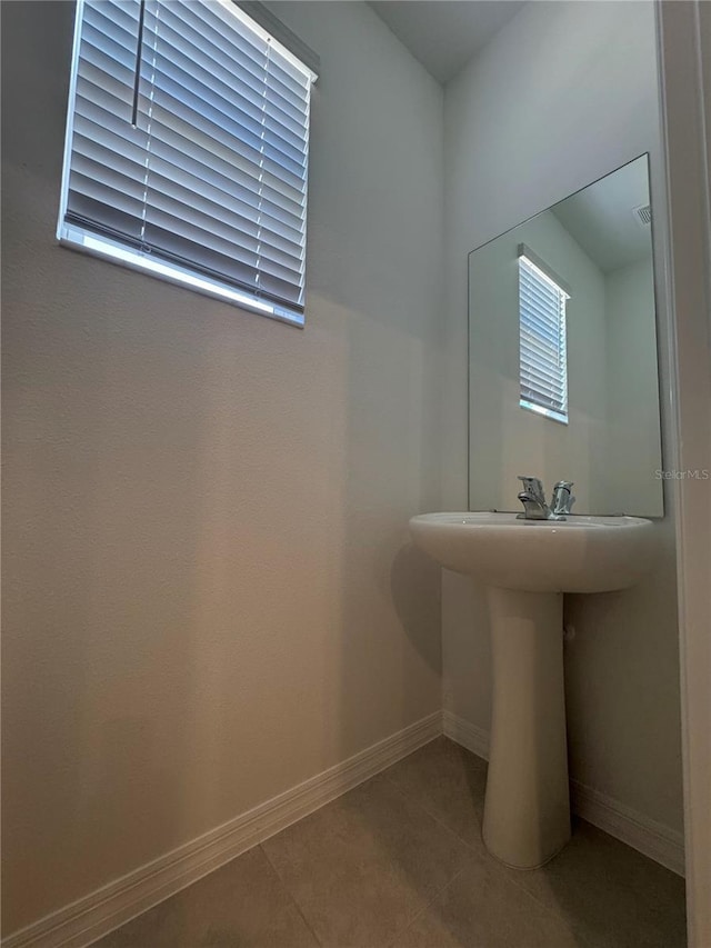 bathroom with tile patterned flooring