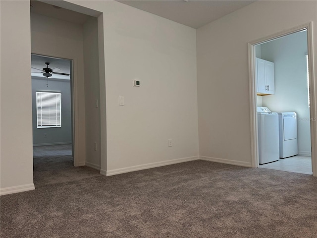 carpeted spare room with ceiling fan and independent washer and dryer