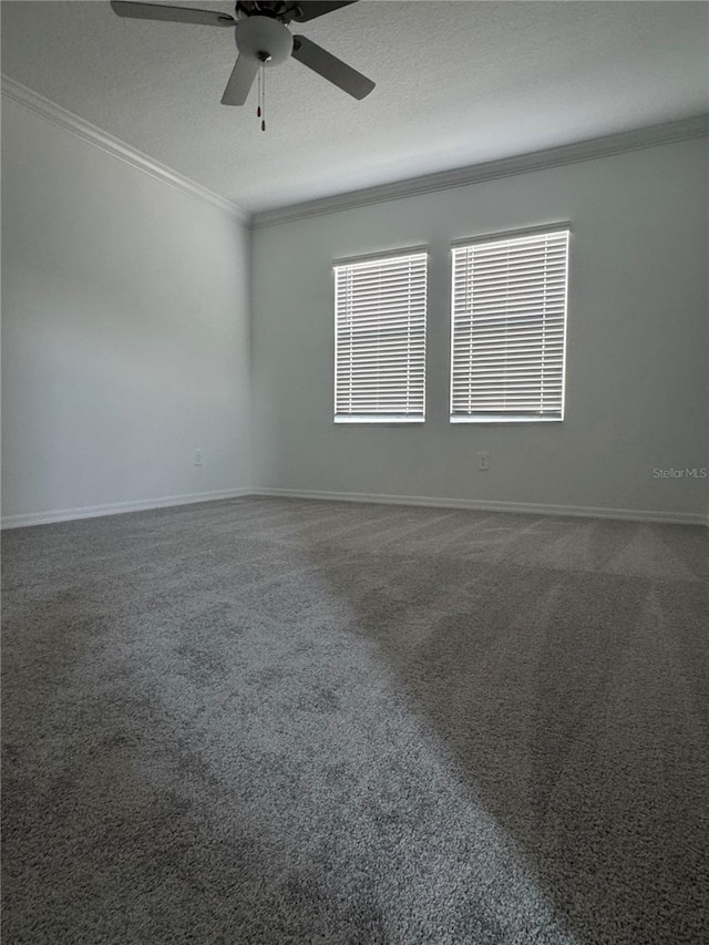 unfurnished room featuring ornamental molding, carpet floors, ceiling fan, and a textured ceiling