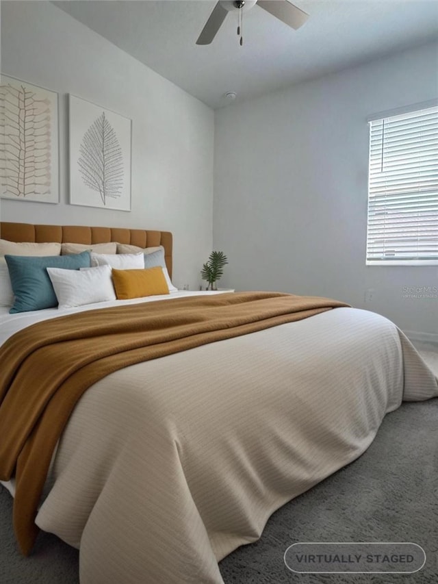 bedroom with ceiling fan and carpet