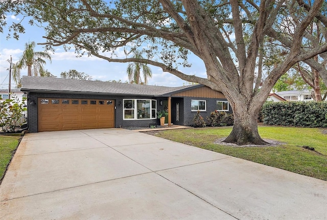 ranch-style house with a garage and a front yard