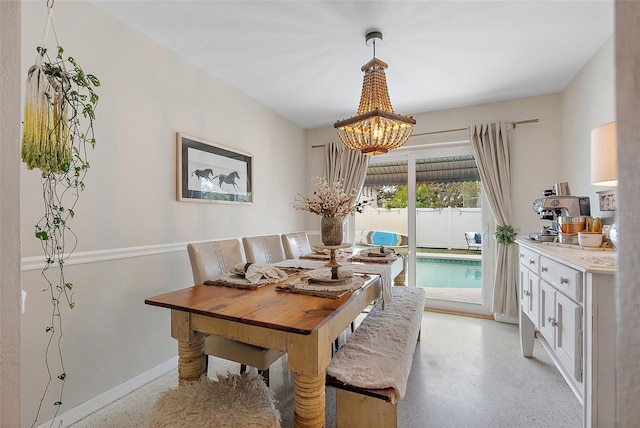 dining area with a notable chandelier