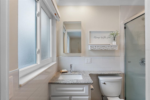 bathroom with vanity, tile walls, an enclosed shower, and toilet