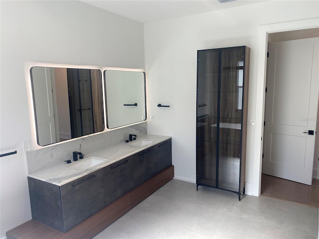 bathroom featuring tile patterned flooring and vanity