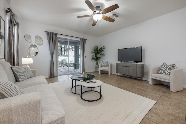 tiled living room with ceiling fan