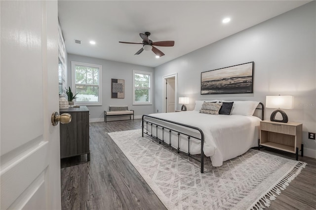 bedroom featuring dark hardwood / wood-style floors and ceiling fan