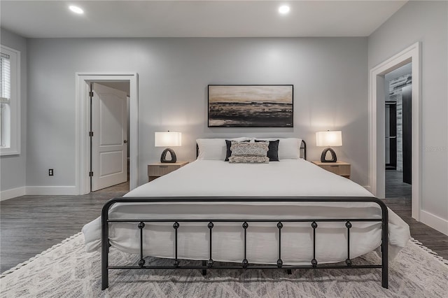 bedroom featuring dark hardwood / wood-style flooring