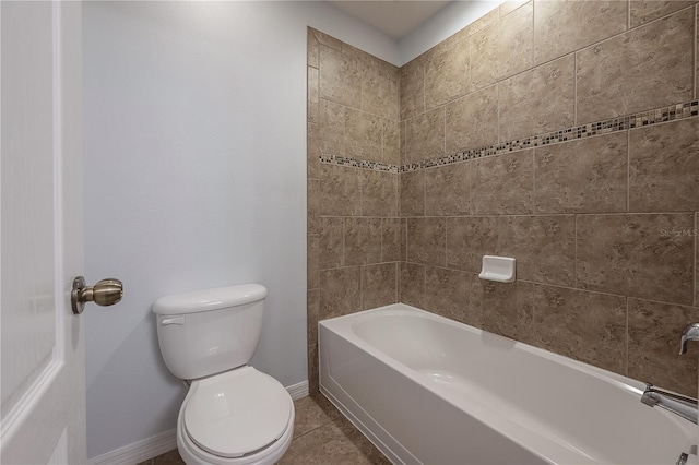 bathroom with tile patterned floors, toilet, and tub / shower combination