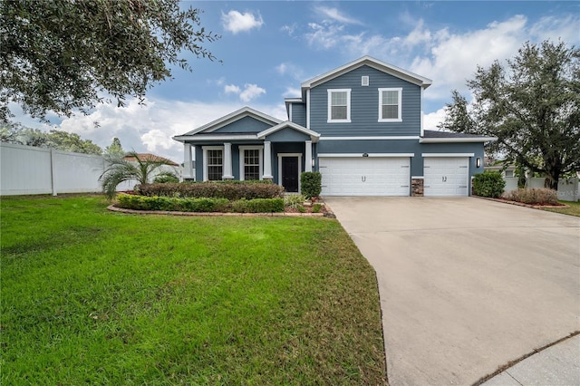 view of front of property featuring a garage and a front yard