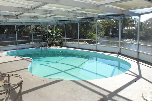 view of pool featuring a lanai and a patio