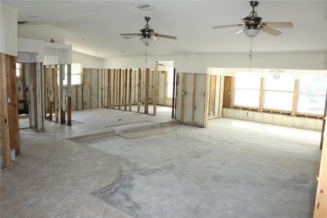 interior space featuring plenty of natural light, vaulted ceiling, and ceiling fan