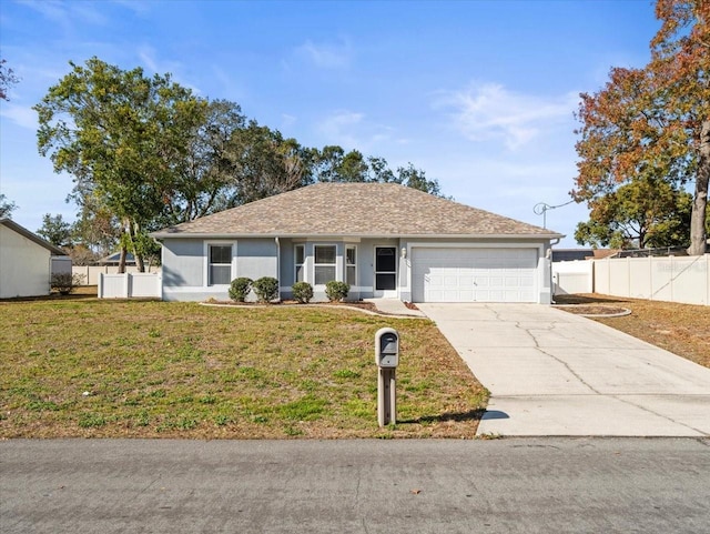 ranch-style home featuring a garage and a front lawn