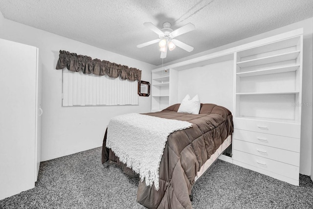 carpeted bedroom with ceiling fan and a textured ceiling