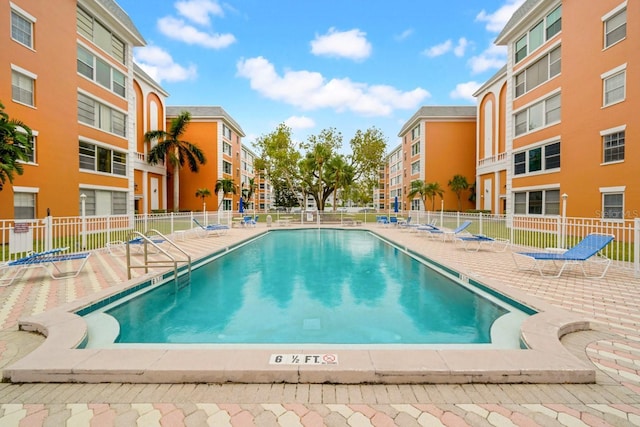 view of swimming pool featuring a patio