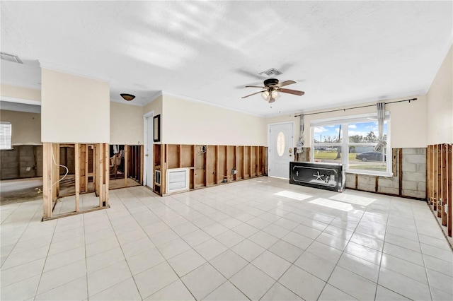 unfurnished living room featuring light tile patterned flooring and ceiling fan