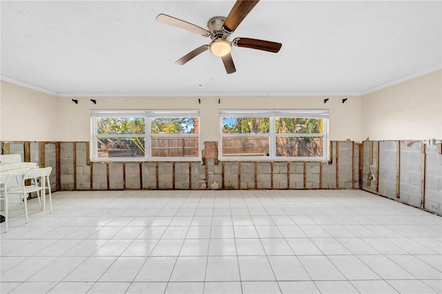 unfurnished room featuring crown molding and ceiling fan