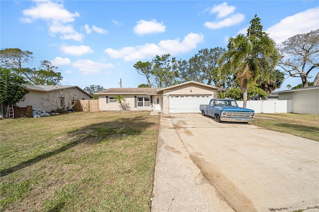 ranch-style house with a garage and a front yard