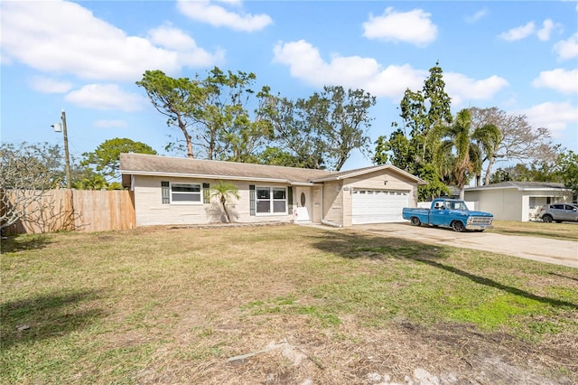 ranch-style home with a garage and a front yard