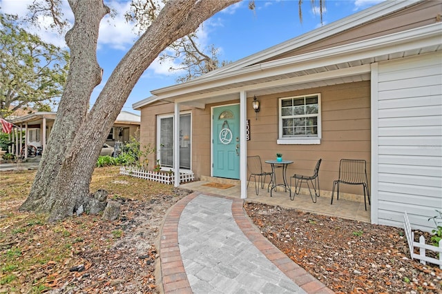 doorway to property with a porch