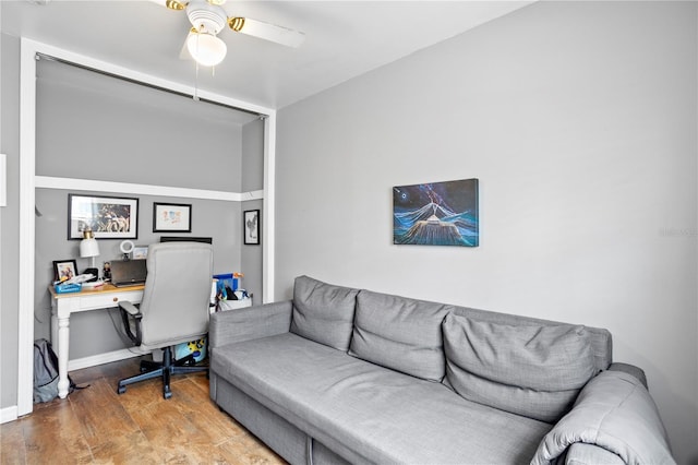 office space with wood-type flooring and ceiling fan