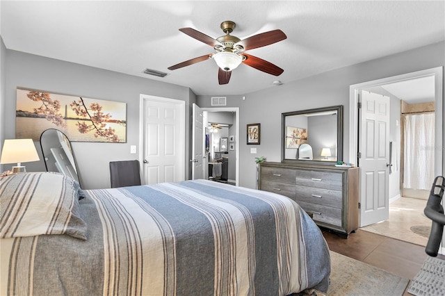 bedroom with tile patterned floors and ceiling fan