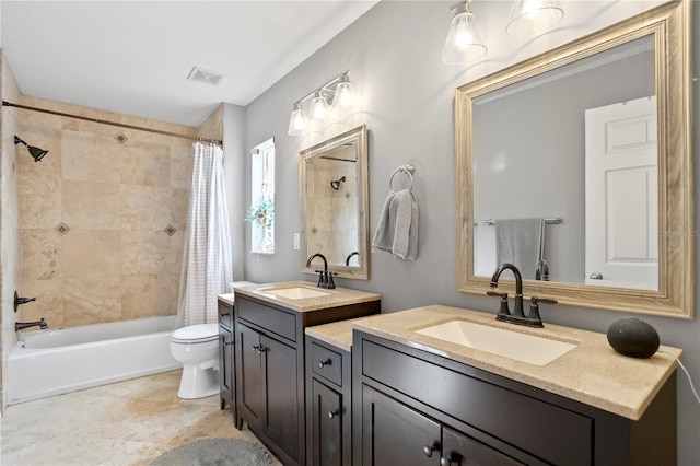 full bathroom featuring vanity, shower / bath combo with shower curtain, and toilet