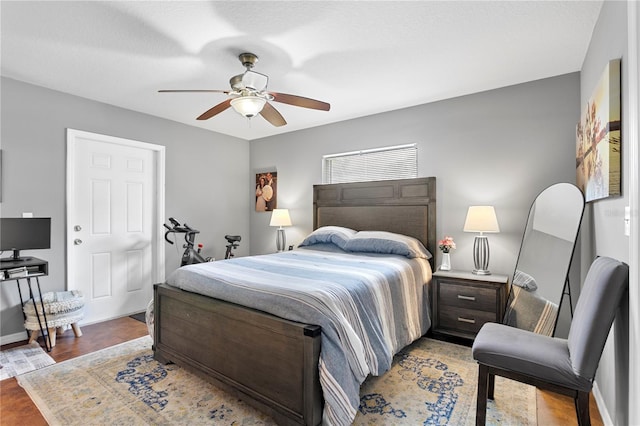 bedroom featuring ceiling fan and wood-type flooring