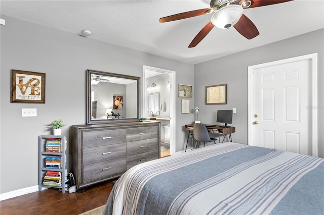 bedroom with connected bathroom, a textured ceiling, and ceiling fan