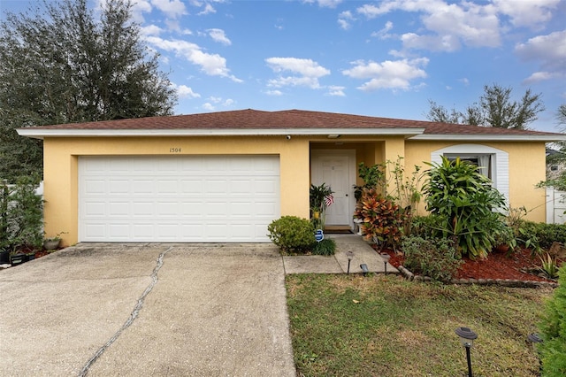 single story home featuring a garage