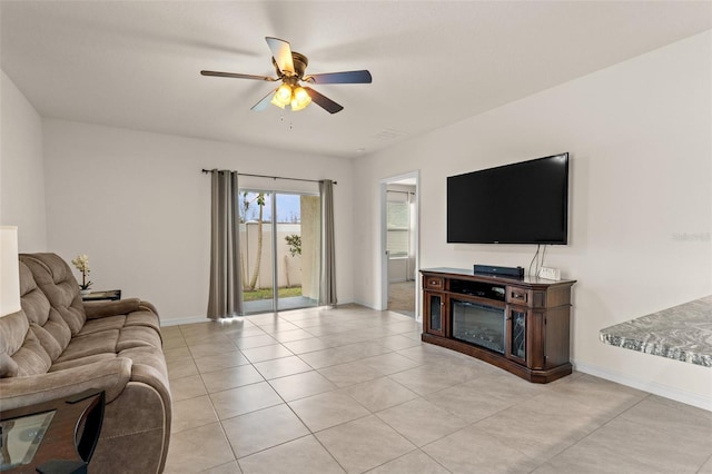 living room with light tile patterned floors and ceiling fan