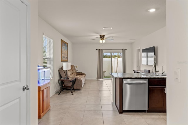 kitchen with dishwasher, sink, ceiling fan, light tile patterned floors, and dark brown cabinets