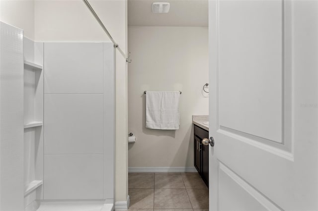 bathroom featuring tile patterned flooring and vanity