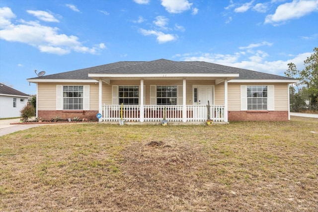 ranch-style home with a front lawn and covered porch