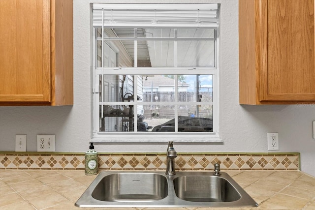 kitchen featuring sink and decorative backsplash