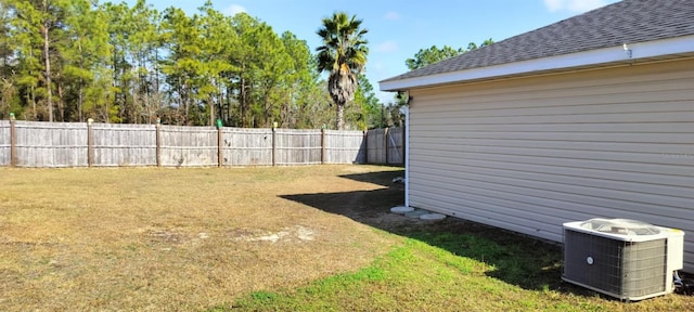 view of yard with central AC unit