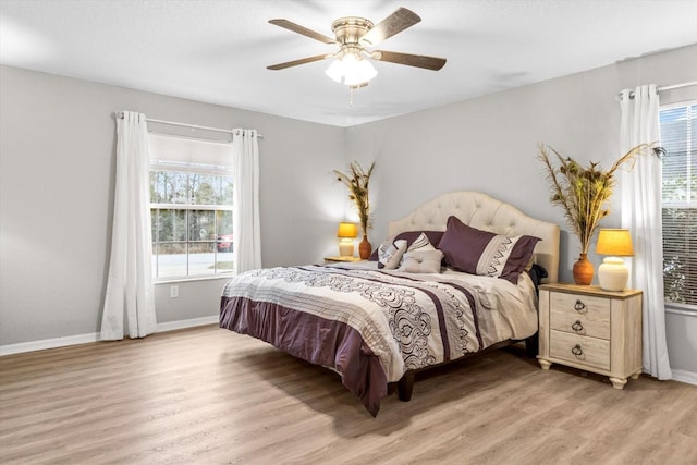 bedroom with hardwood / wood-style floors and ceiling fan