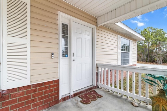 doorway to property with a porch