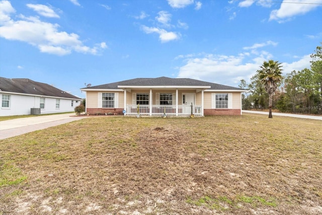 single story home featuring a porch, cooling unit, and a front lawn